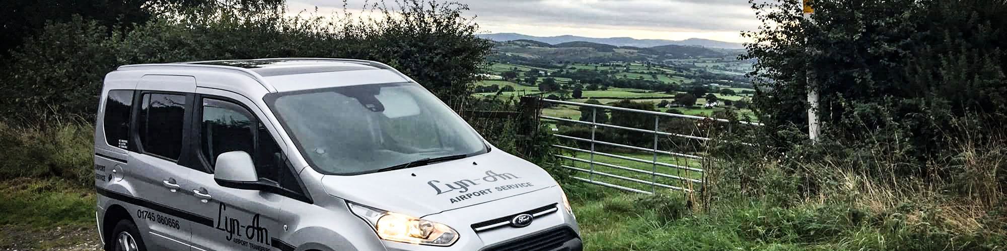 Minibus next to farm gate in North Wales