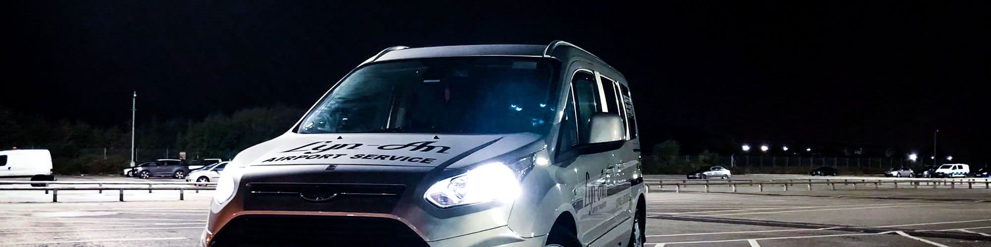 Lyn-An Airport Transfers minibus in car park at night