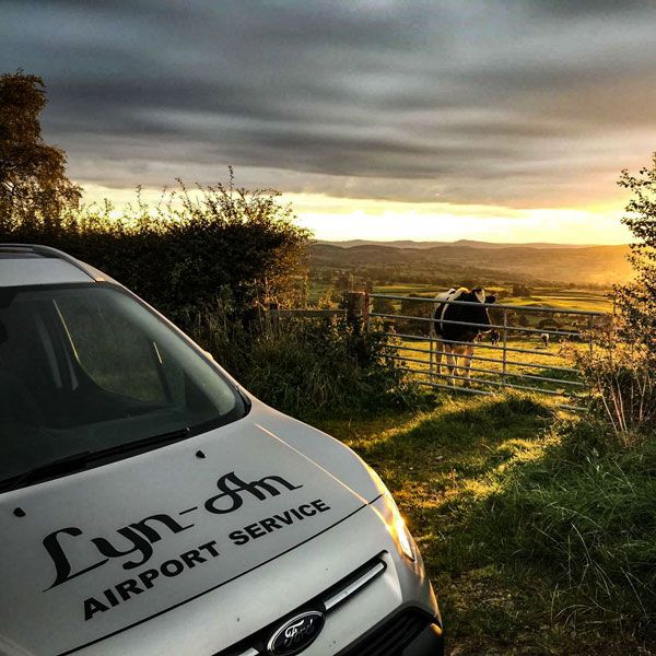 Minibus next to farm land